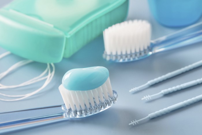 Toothbrush, fluoride toothpaste, and dental floss for oral care and tooth decay prevention