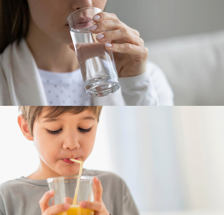 A woman drinks water, and a child drinks juice through a straw to avoid enamel erosion.