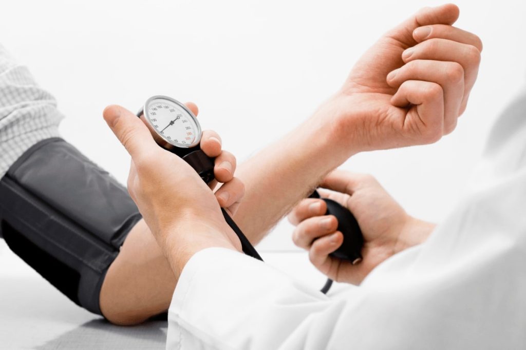 Patient having their blood pressure checked before a dental procedure