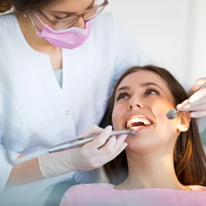 Dentist treating patient in clinic